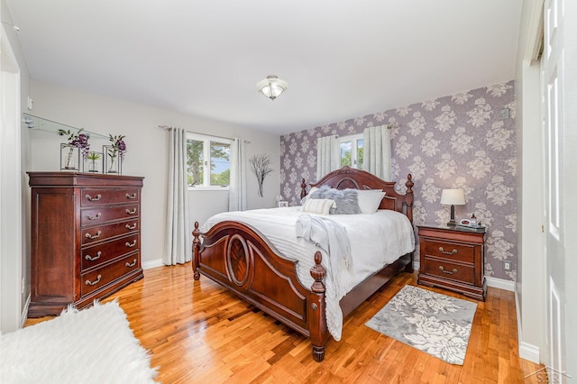 4170 Clement Dr, Saginaw, MI 48603 - bedroom with light wood-style flooring and wallpapered walls