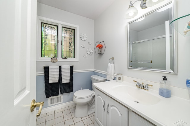 4170 Clement Dr, Saginaw, MI 48603 - bathroom with tile patterned floors, vanity, and a shower with shower door