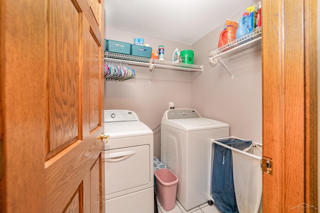 4170 Clement Dr, Saginaw, MI 48603 - laundry area with washing machine and dryer and light tile patterned floors