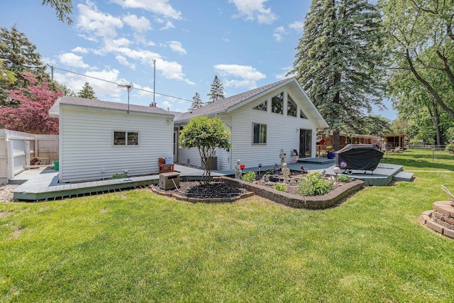 4170 Clement Dr, Saginaw, MI 48603 - rear view of property featuring a deck, a fenced backyard, and a patio