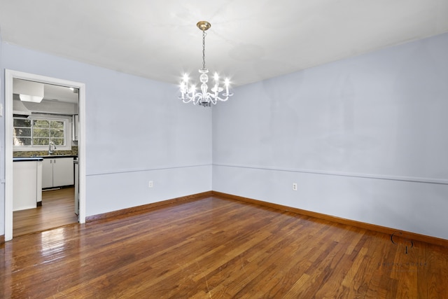 36254 Congress Rd, Farmington Hills, MI 48335 - empty room with a chandelier and wood finished floors