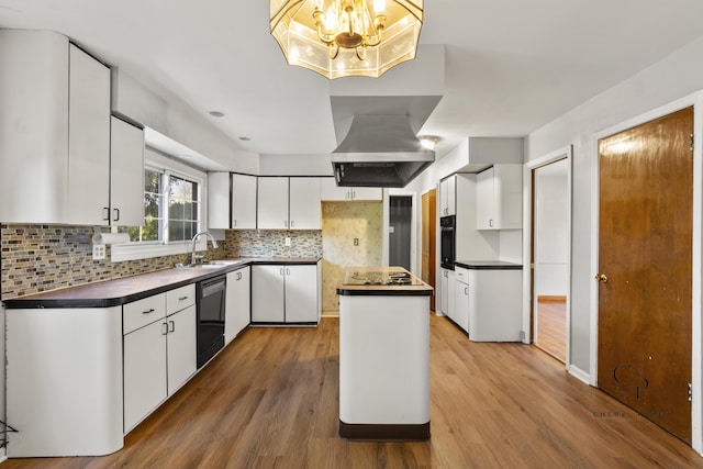 36254 Congress Rd, Farmington Hills, MI 48335 - kitchen with dark countertops, black appliances, island exhaust hood, white cabinets, and backsplash