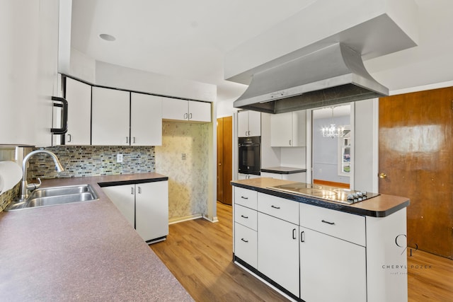 36254 Congress Rd, Farmington Hills, MI 48335 - kitchen featuring black oven, electric cooktop, light wood-style floors, and white cabinetry