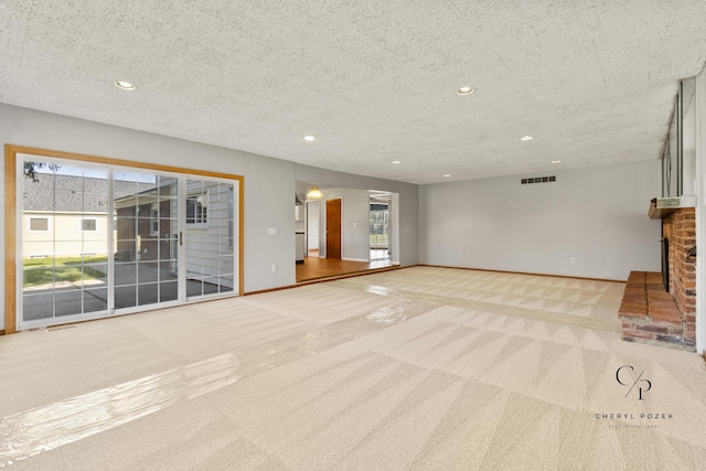36254 Congress Rd, Farmington Hills, MI 48335 - unfurnished living room featuring carpet floors, a brick fireplace, recessed lighting, and a textured ceiling