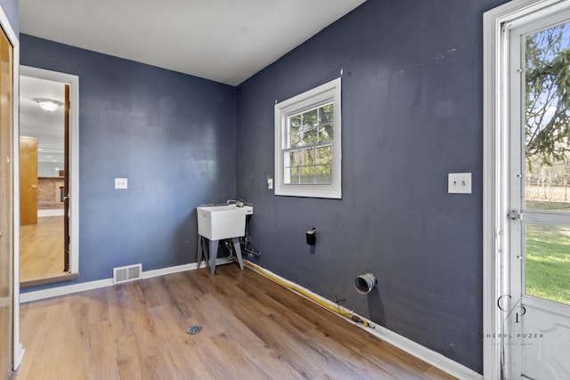 36254 Congress Rd, Farmington Hills, MI 48335 - laundry room with wood finished floors and plenty of natural light