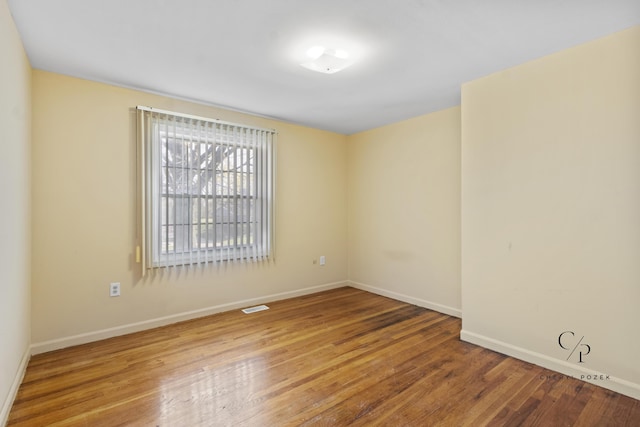 36254 Congress Rd, Farmington Hills, MI 48335 - unfurnished room featuring baseboards and wood finished floors