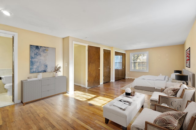 36254 Congress Rd, Farmington Hills, MI 48335 - bedroom with wood finished floors, connected bathroom, and two closets