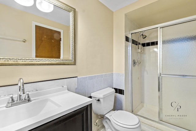 36254 Congress Rd, Farmington Hills, MI 48335 - bathroom featuring a shower stall, vanity, wainscoting, and tile walls