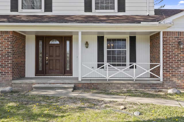 36254 Congress Rd, Farmington Hills, MI 48335 - property entrance with brick siding, a shingled roof, and covered porch