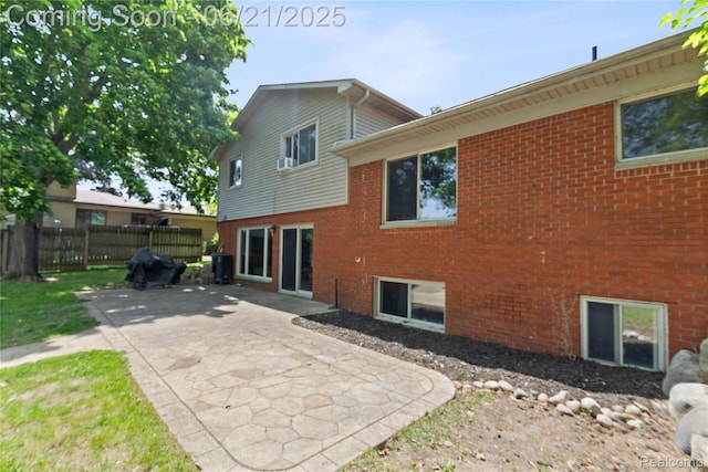 527 Tanview Dr, Oxford, MI 48371 - rear view of property featuring brick siding and a patio