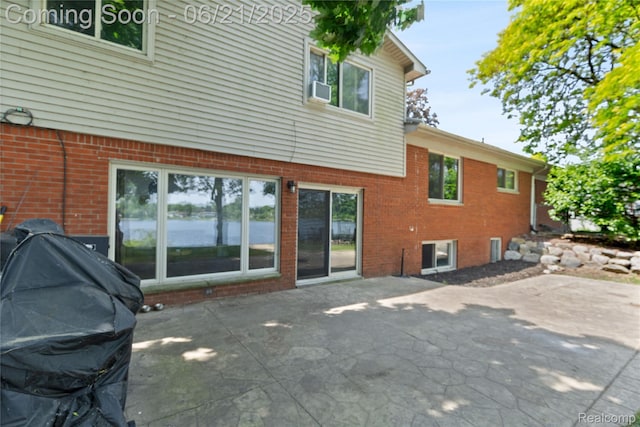 527 Tanview Dr, Oxford, MI 48371 - rear view of property with a patio area and brick siding
