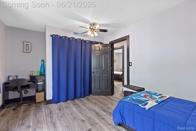 527 Tanview Dr, Oxford, MI 48371 - bedroom featuring wood finished floors, a desk, and a ceiling fan