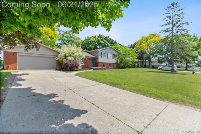 527 Tanview Dr, Oxford, MI 48371 - split level home featuring brick siding, driveway, a front yard, and an attached garage