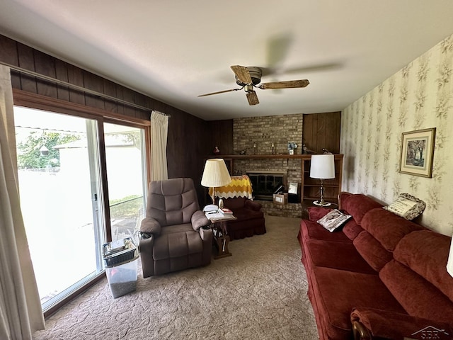 5697 Dunrovin Dr, Saginaw, MI 48638 - living area with carpet, ceiling fan, and a fireplace