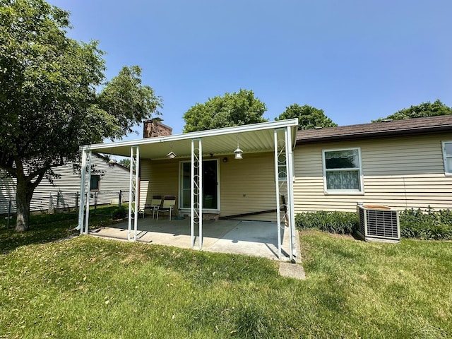 5697 Dunrovin Dr, Saginaw, MI 48638 - back of property featuring a yard, a chimney, and a patio
