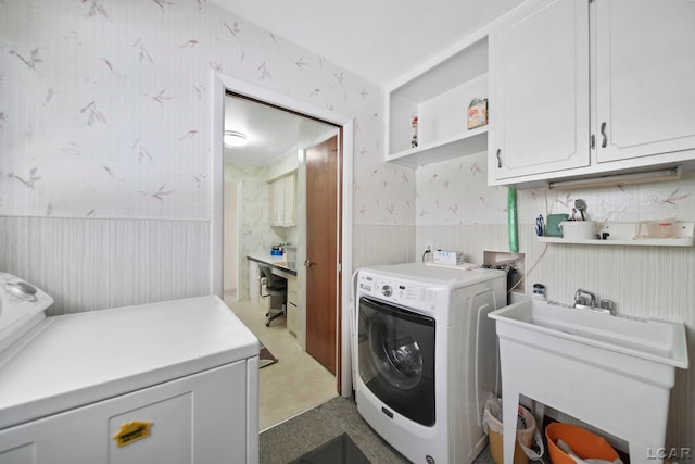 9760 Lime Lake Rd, Hudson, MI 49247 - laundry room featuring wallpapered walls, cabinet space, a wainscoted wall, and washer and dryer