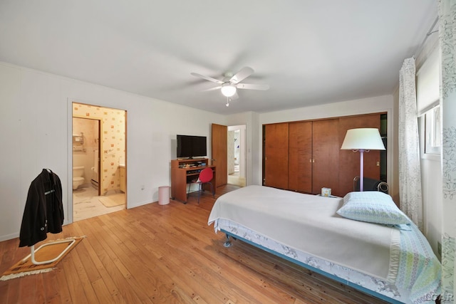9760 Lime Lake Rd, Hudson, MI 49247 - bedroom featuring wood-type flooring, a closet, ensuite bath, and a ceiling fan