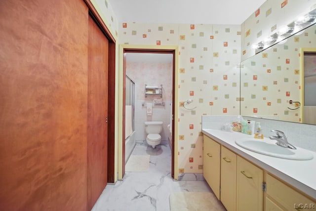 9760 Lime Lake Rd, Hudson, MI 49247 - bathroom featuring vanity, marble finish floors, and shower / bath combination with glass door