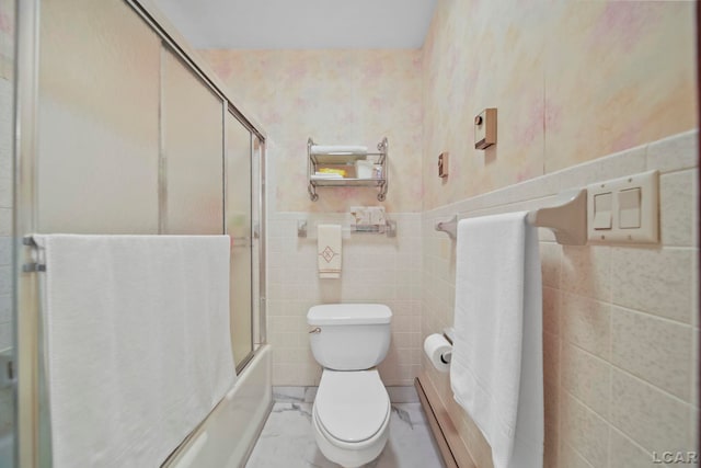 9760 Lime Lake Rd, Hudson, MI 49247 - full bathroom with tile walls, a wainscoted wall, enclosed tub / shower combo, and tile patterned floors