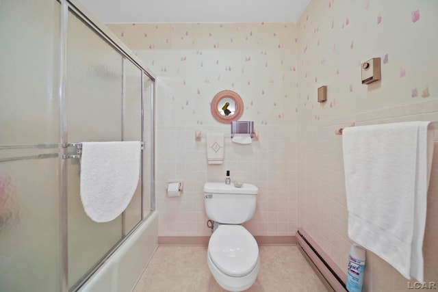 9760 Lime Lake Rd, Hudson, MI 49247 - bathroom with baseboard heating, shower / bath combination with glass door, a wainscoted wall, tile patterned floors, and tile walls