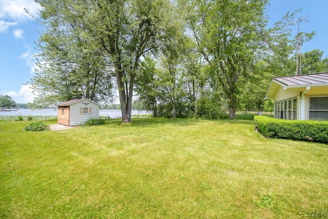9760 Lime Lake Rd, Hudson, MI 49247 - view of green lawn featuring a storage unit