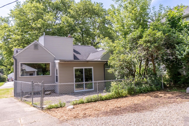 1215 Prescott Ave, Ann Arbor, MI 48103 - view of front of property featuring a chimney and a shingled roof