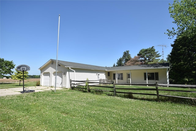 11057 Hogan Rd, Fenton, MI 48436 - view of front facade with concrete driveway and a garage
