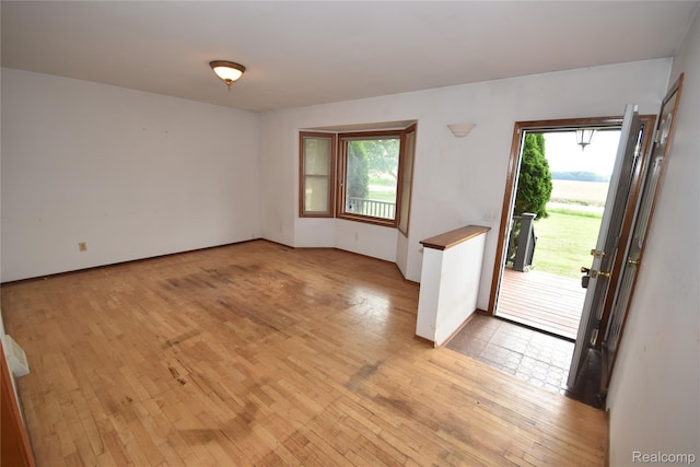11057 Hogan Rd, Fenton, MI 48436 - empty room with light wood-style flooring