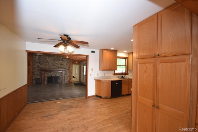 11057 Hogan Rd, Fenton, MI 48436 - kitchen featuring dishwasher, a ceiling fan, light wood-type flooring, light countertops, and a fireplace