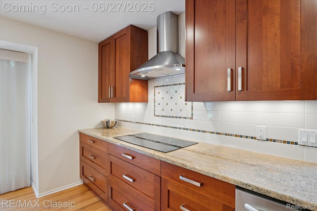 35606 Huntsman Ct, Farmington Hills, MI 48331 - kitchen with wall chimney range hood, black electric stovetop, brown cabinetry, light wood finished floors, and tasteful backsplash