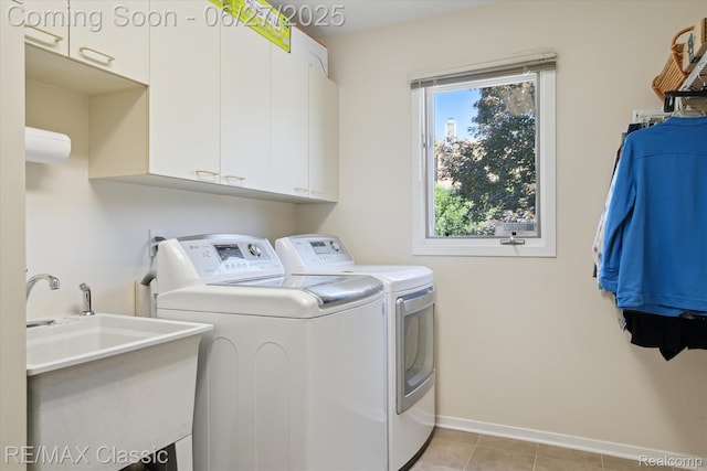 35606 Huntsman Ct, Farmington Hills, MI 48331 - washroom with cabinet space, washing machine and clothes dryer, and light tile patterned flooring