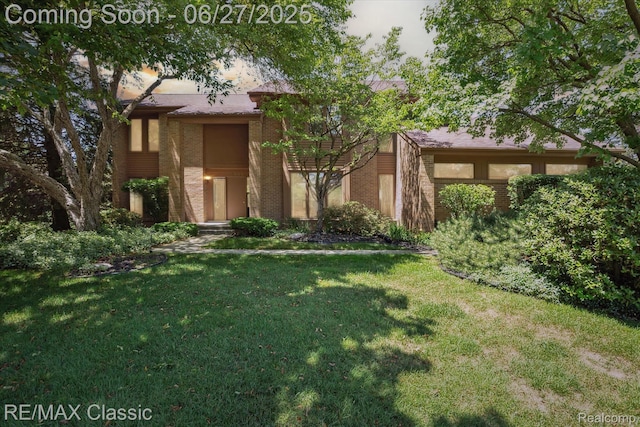 35606 Huntsman Ct, Farmington Hills, MI 48331 - view of front of house with brick siding and a front yard