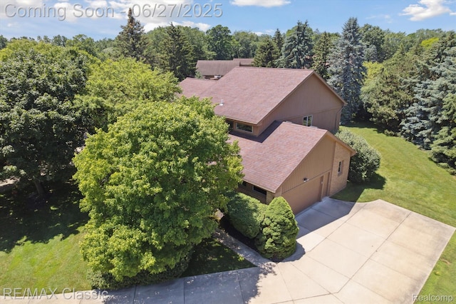 35606 Huntsman Ct, Farmington Hills, MI 48331 - aerial view of property and surrounding area featuring a heavily wooded area