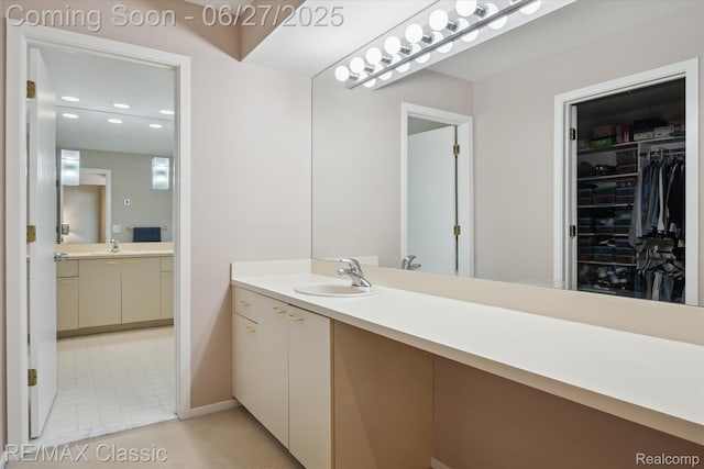 35606 Huntsman Ct, Farmington Hills, MI 48331 - bathroom with vanity, a spacious closet, and recessed lighting