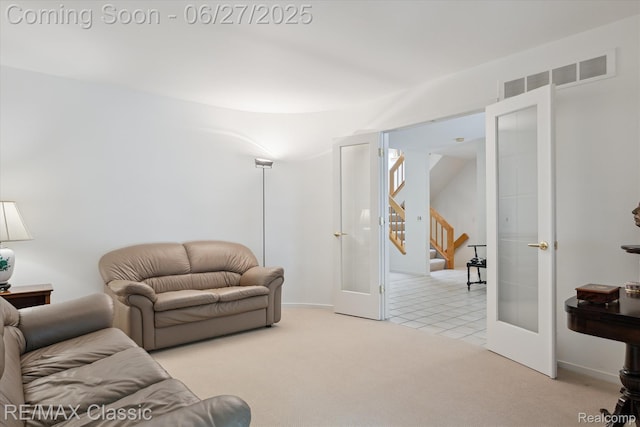 35606 Huntsman Ct, Farmington Hills, MI 48331 - living area featuring french doors, carpet flooring, and stairway