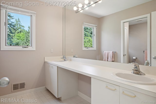35606 Huntsman Ct, Farmington Hills, MI 48331 - full bath with double vanity and tile patterned flooring
