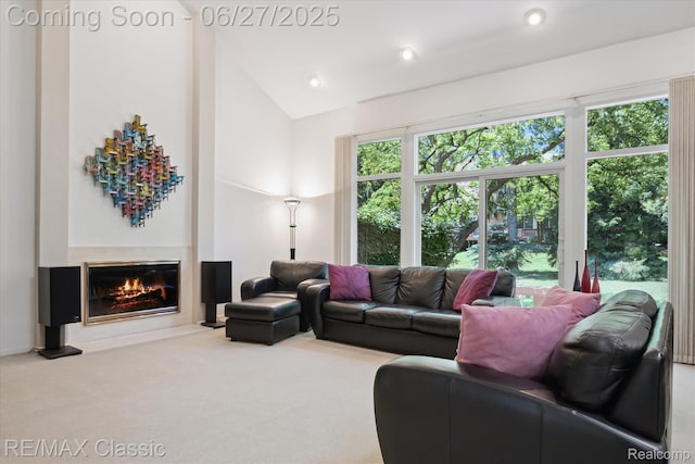 35606 Huntsman Ct, Farmington Hills, MI 48331 - carpeted living room with a glass covered fireplace, lofted ceiling, and recessed lighting