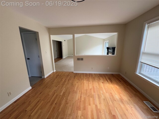 3163 Mystic Valley Dr, White Lake, MI 48383 - unfurnished room featuring light wood-style flooring and baseboards