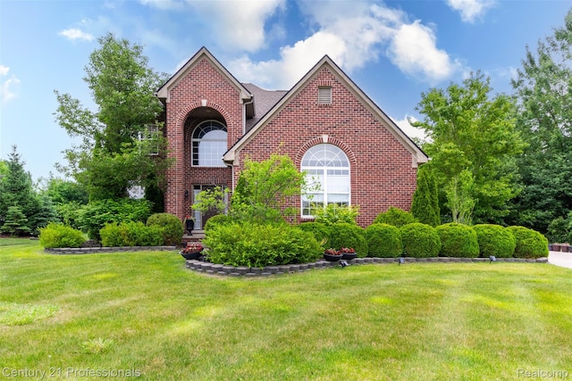 23640 Woodside Ct, South Lyon, MI 48178 - traditional home featuring brick siding and a front yard