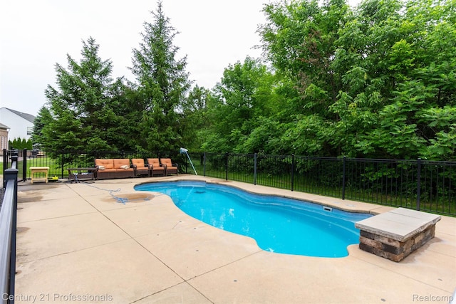 23640 Woodside Ct, South Lyon, MI 48178 - view of swimming pool featuring a patio and outdoor lounge area