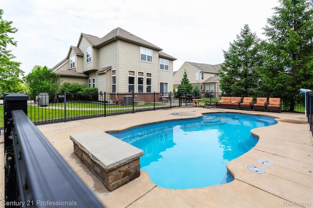 23640 Woodside Ct, South Lyon, MI 48178 - view of swimming pool featuring an outdoor living space and a patio