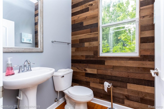 23640 Woodside Ct, South Lyon, MI 48178 - half bathroom with wood walls and wood finished floors