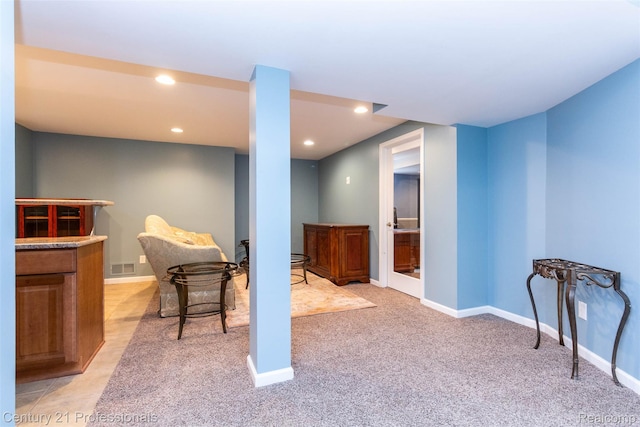 23640 Woodside Ct, South Lyon, MI 48178 - finished below grade area with recessed lighting, light colored carpet, and a bar
