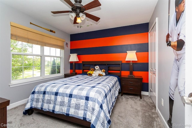 23640 Woodside Ct, South Lyon, MI 48178 - bedroom with carpet floors, an accent wall, and ceiling fan