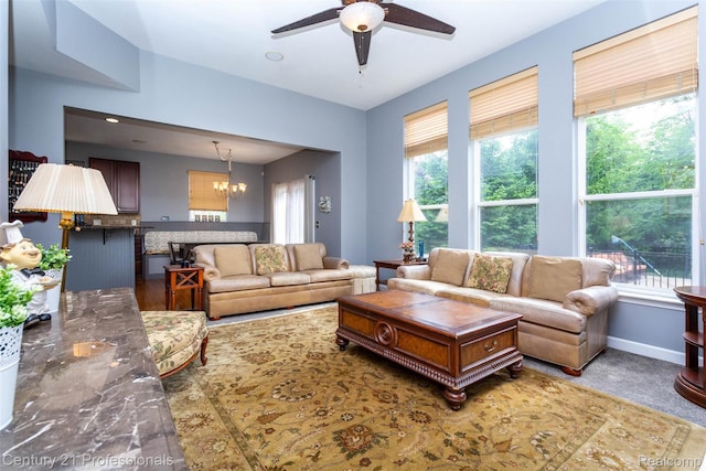 23640 Woodside Ct, South Lyon, MI 48178 - living area with ceiling fan, plenty of natural light, and a chandelier