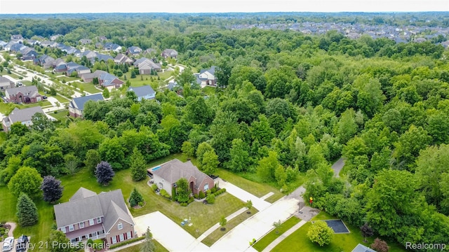 23640 Woodside Ct, South Lyon, MI 48178 - aerial view of residential area with a heavily wooded area