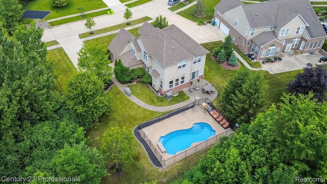 23640 Woodside Ct, South Lyon, MI 48178 - view from above of property with a pool area