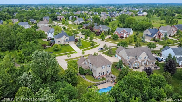 23640 Woodside Ct, South Lyon, MI 48178 - aerial perspective of suburban area featuring a pool area