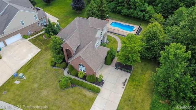 23640 Woodside Ct, South Lyon, MI 48178 - view from above of property featuring a pool area