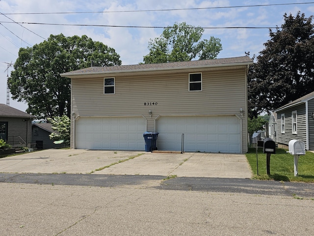 83140 Waldron Dr, Lawton, MI 49065 - garage featuring concrete driveway